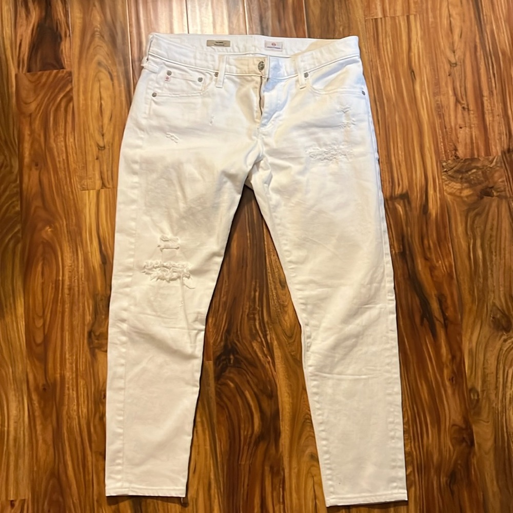 Women’s AG distressed relaxed skinny jeans.
